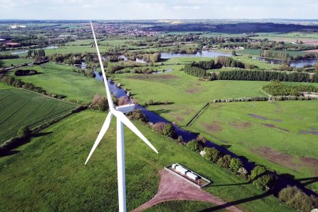 Wind turbine and agricultural fields - a diverse landscape with multiple uses to support a blog on the land use framework.